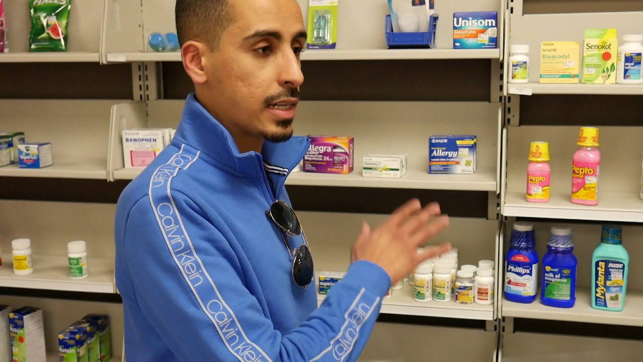 Man at a pharmacy shelf