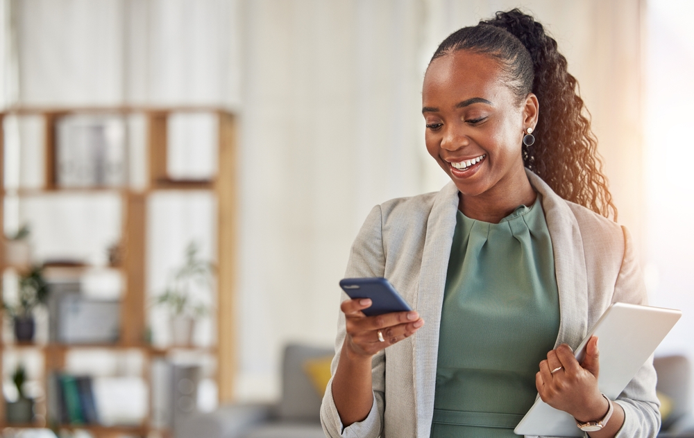 Happy,Black,Woman,,Phone,And,Communication,At,Office,With,Smile